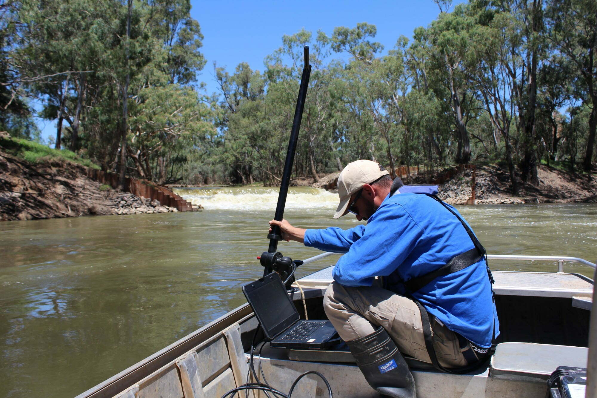John Trethewie (CSU) using boat mounted sonar scans to detect presence and location of fish in the refuge patches in the Edward River. Photo credit, Sam Lewis