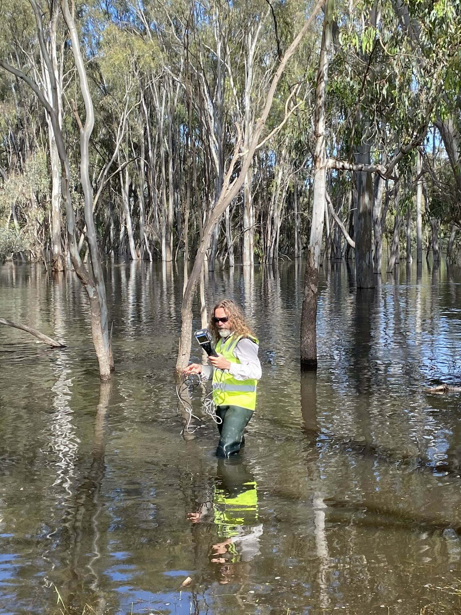 Team member Chris Davey (CSU) undertaking water quality monitoring in the flooded Edward/Kolety River. Photo credit Sha sha Liu, CSU.
